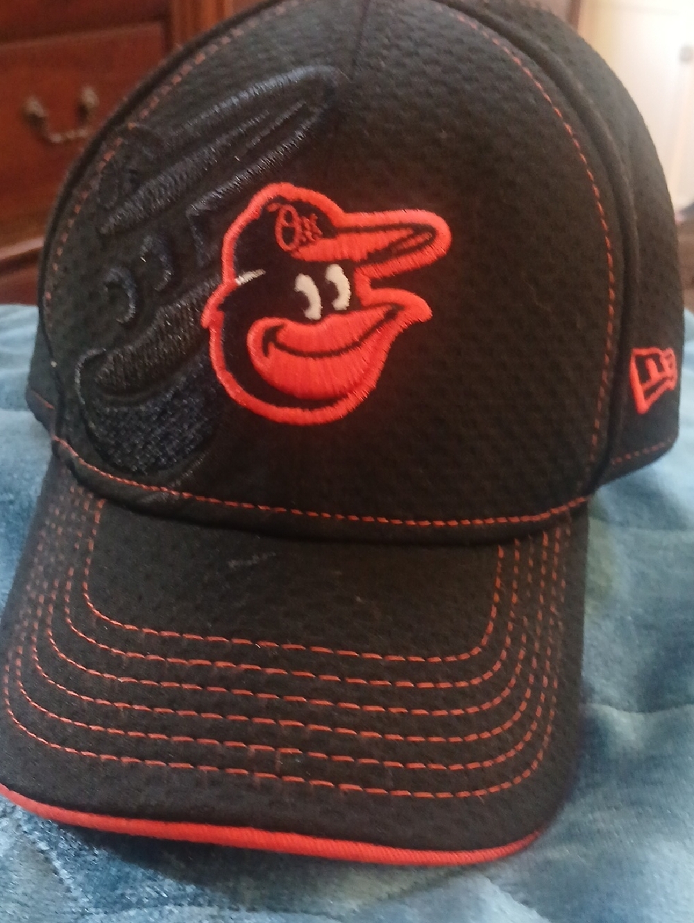 New Era Black Cap with Orange Embroidered Orioles Logo